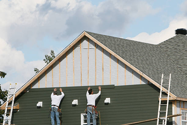 Professional Siding technician working in Kersey, CO